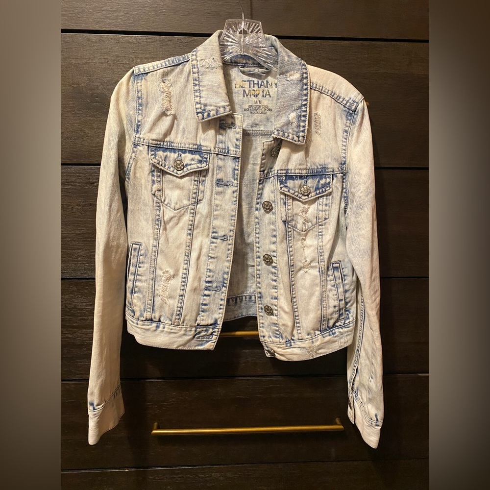 Acid wash, distressed denim jacket. Size medium.